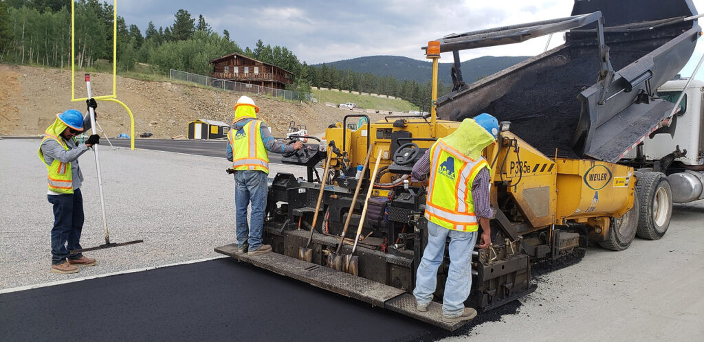 Road Construction with Asphalt Paving Machine - Apex Pavement Solutions